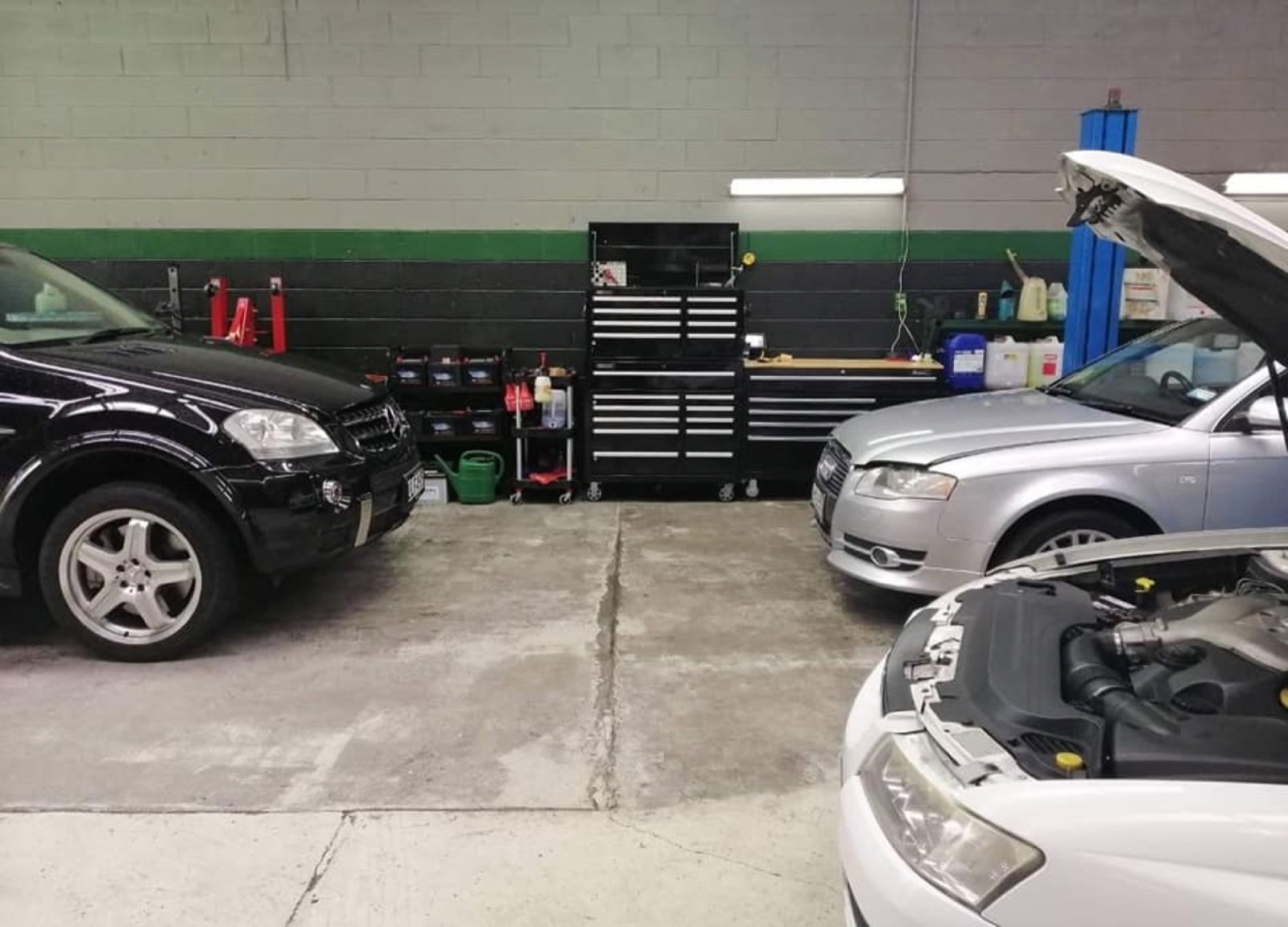 Tidy workshop bay at Precision Automotive — tyre and alignment work